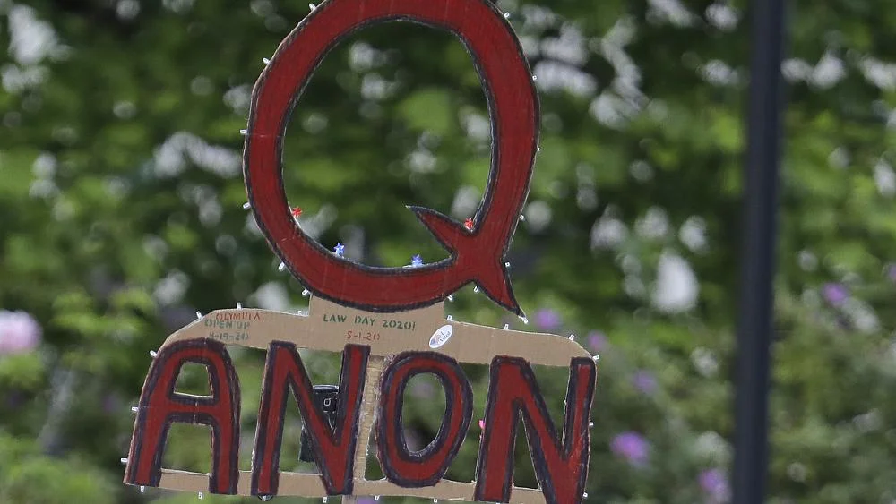 A banned conspiracy channel sued YouTube for its anti-QAnon moderation push